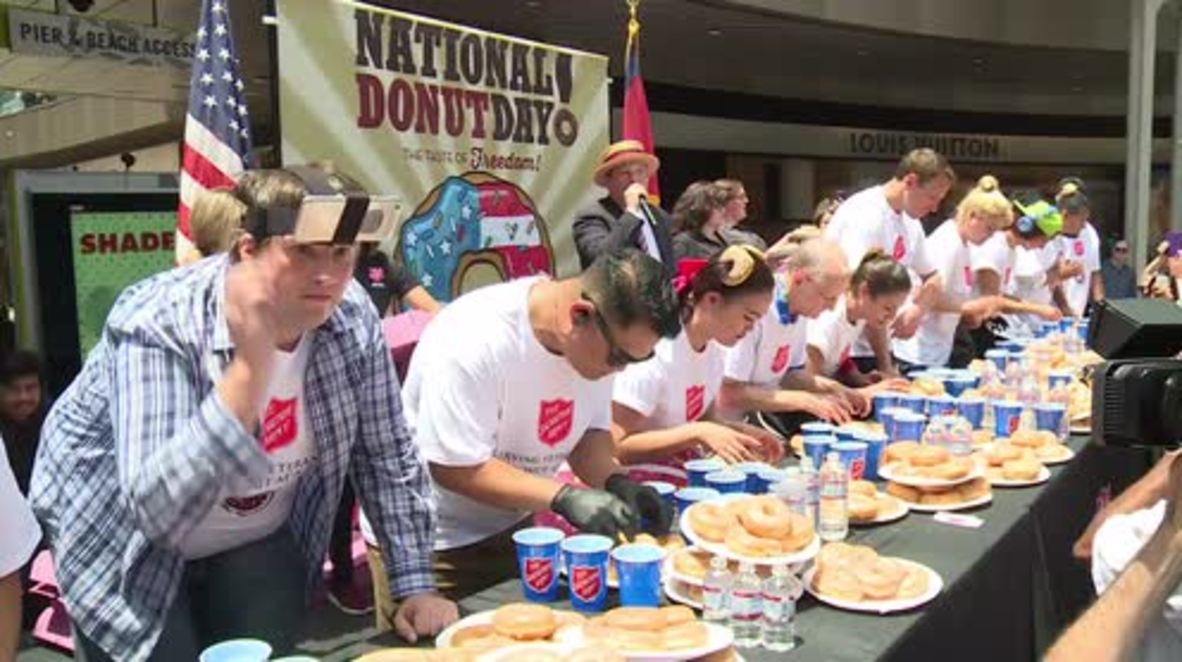 USA: New world record set at doughnut eating contest, Santa Monica