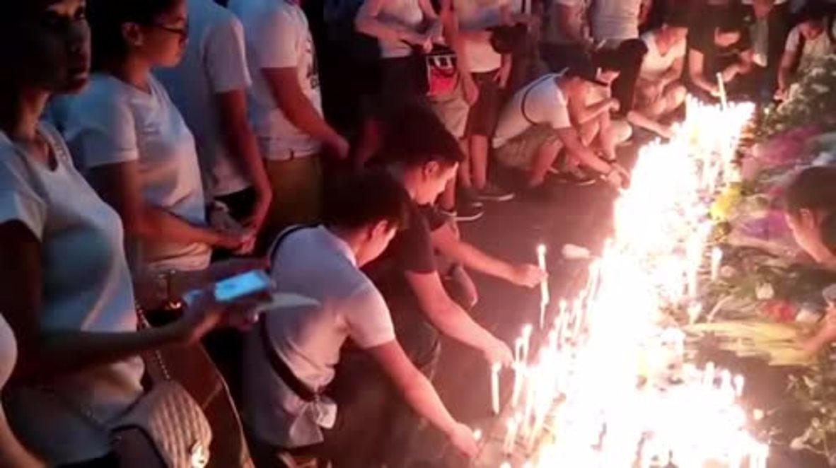 Philippines: Mourners place candles at Resorts World Manila after attack