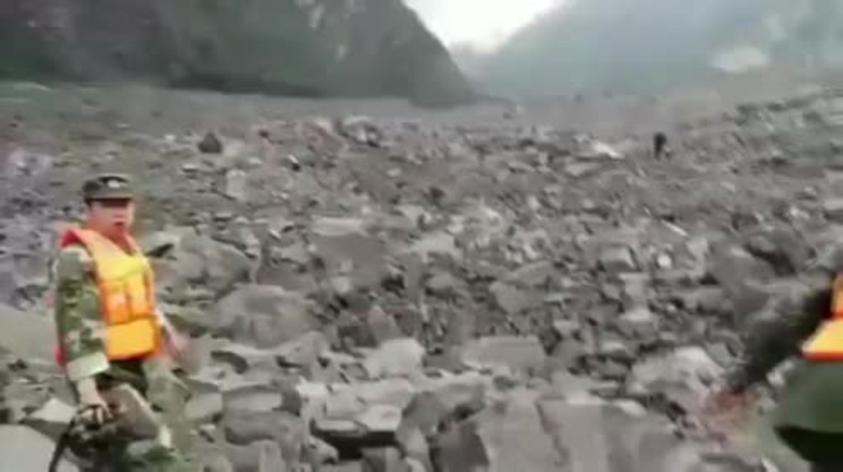 China: Over 100 buried under rubble after landslide hits Sichuan village