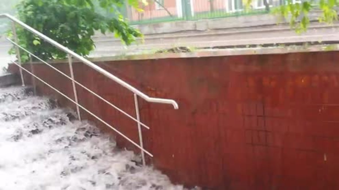 Russia: Heavy rains turn steps into waterfall, Moscow