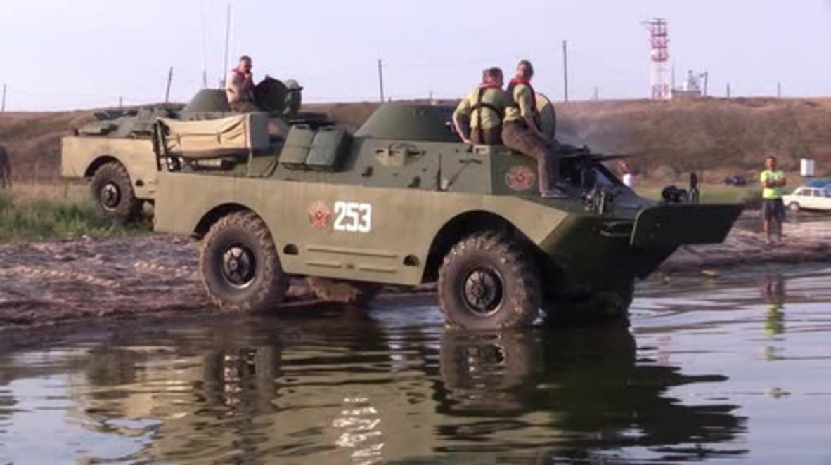 Russia: Dolphins spotted as amphibious APCs cross Kerch Strait in historic re-enactment