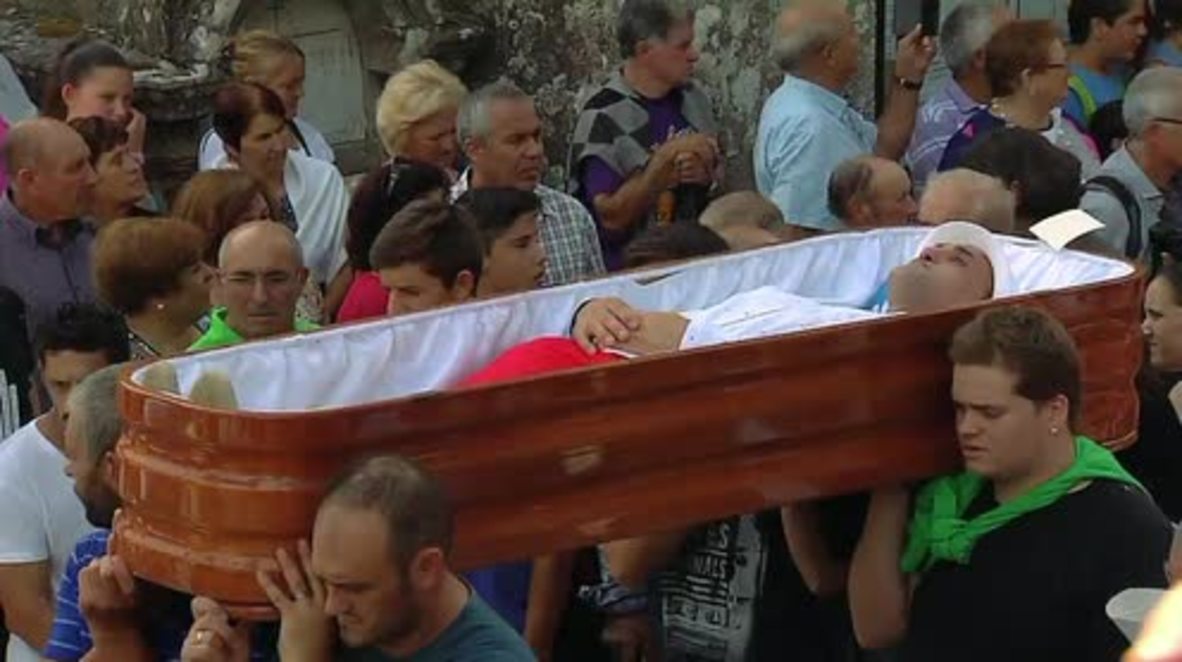 The living paraded in coffins after brushes with death