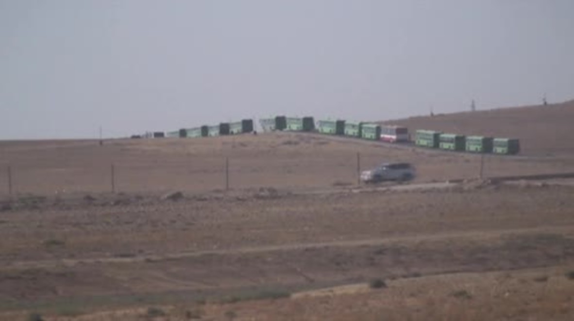 Syria: Militants among thousands arriving in Hama in mass refugee transfer