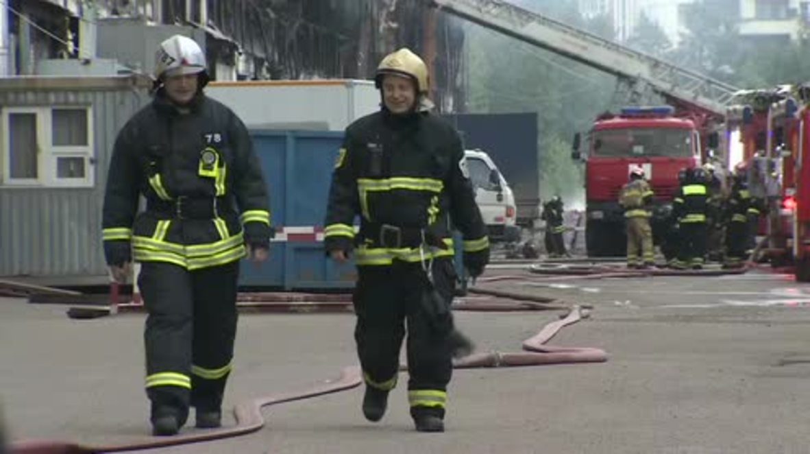 Russia: Warehouse smoulders as firefighters extinguish last flames