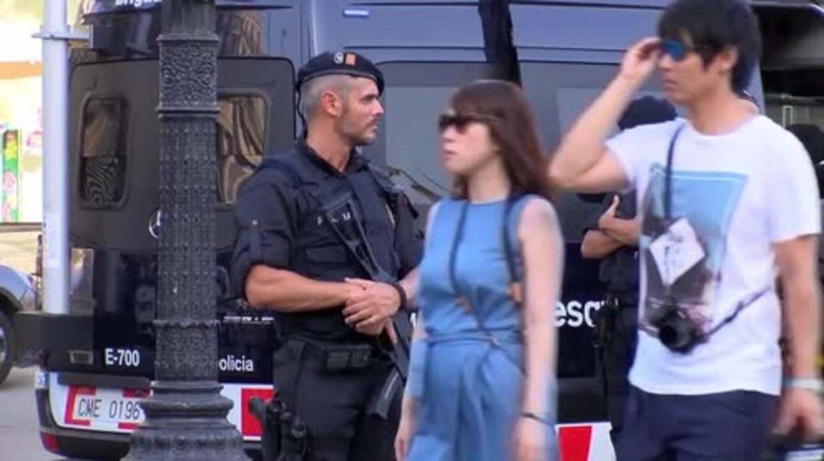 Spain: Armed police patrol Las Ramblas as tourists return to Barcelona streets