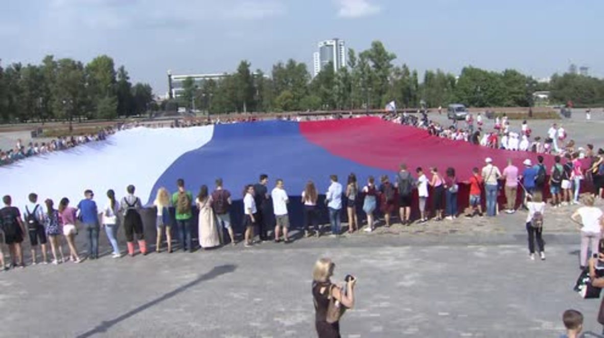 Russia: Huge Russian flag unfurled in Moscow to mark 23rd National Flag Day