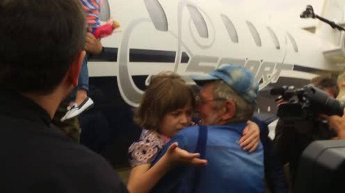 Russia: Tears and hugs as orphaned children of foreign IS fighters return to Grozny