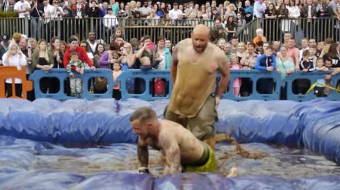WATCH wacky fighters sliding around at World Gravy Wrestling Championship