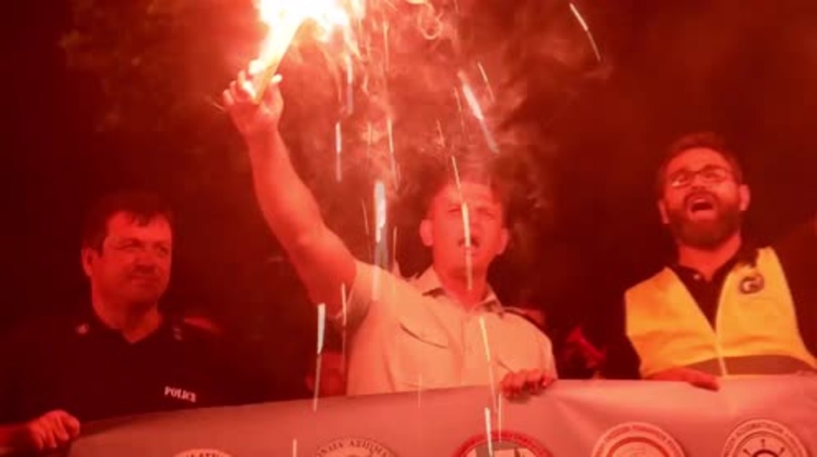 Greece: Flares blaze in the sky at firefighter and police protest ahead of trade fair