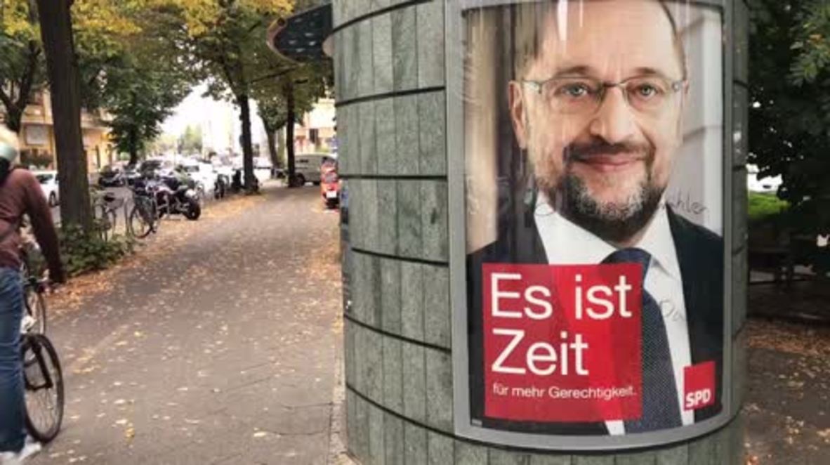 Germany: 'It's time' ... for a pee? Martin Schulz poster plastered on side of Berlin TOILET