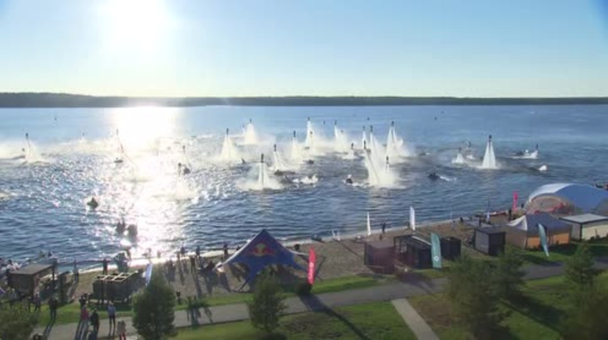 Sky's the limit! Watch dozens of daredevil-flyboarders soar over Volga River