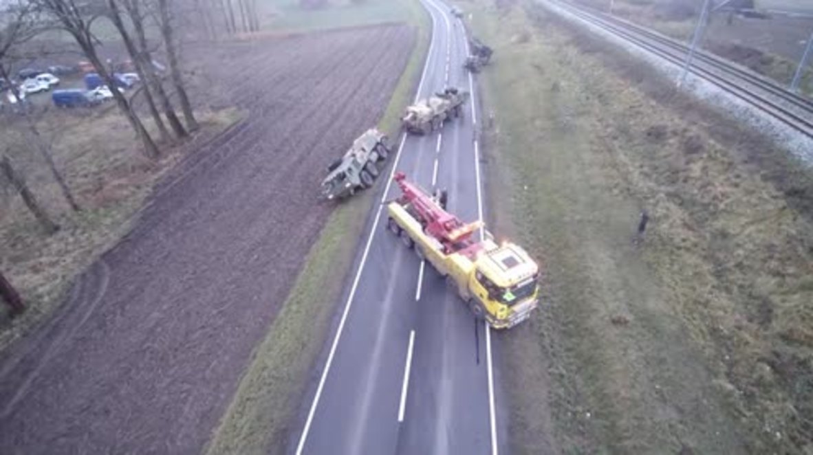 Poland: Stuck in the mud! US Army convoy grinds to a halt in roadside ditch