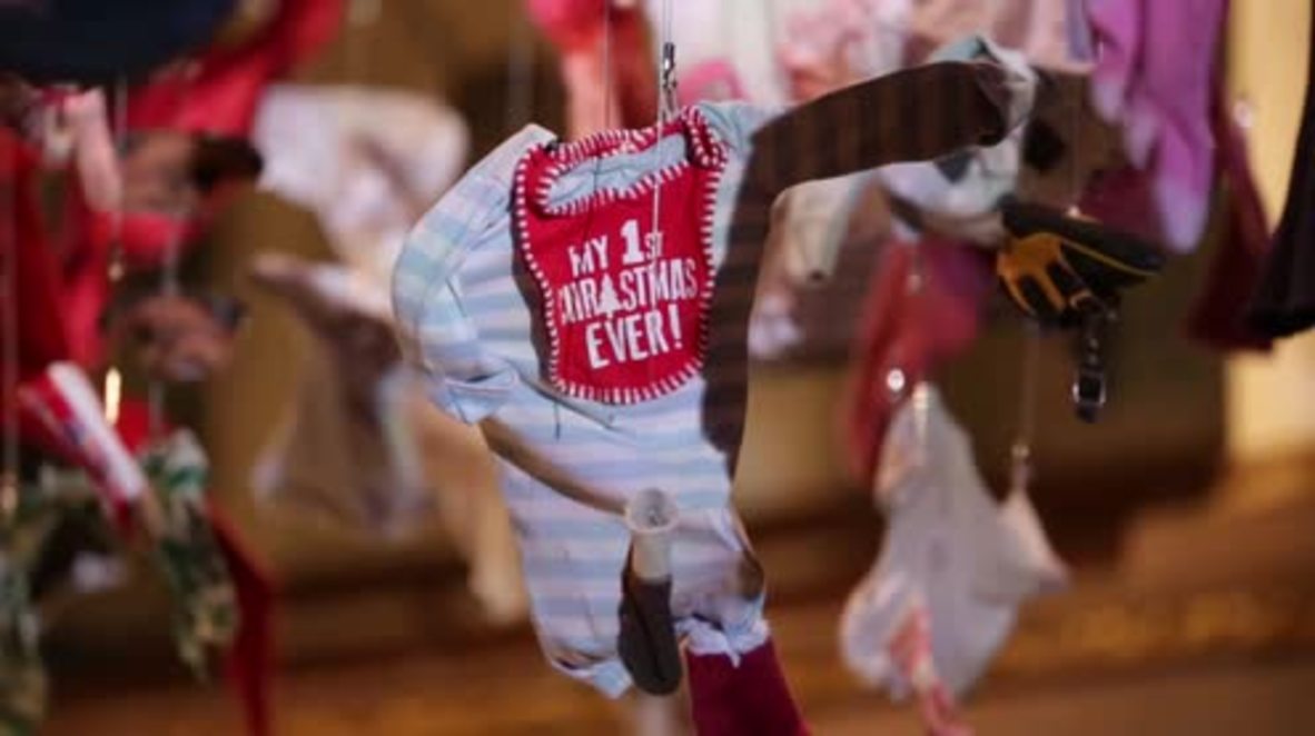 UK: Artist drapes London church with refugees’ clothing to raise awareness