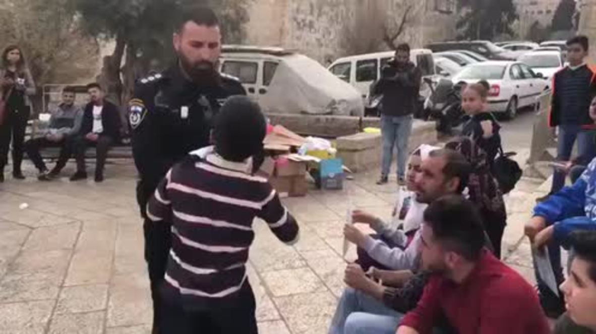 East Jerusalem: Israeli soldier rips scarf from Palestinian child's neck