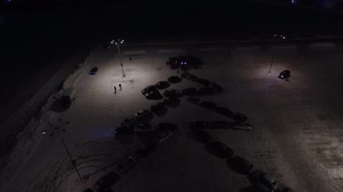 Driving home for Christmas! Cars in Vladimir park in Christmas tree formation