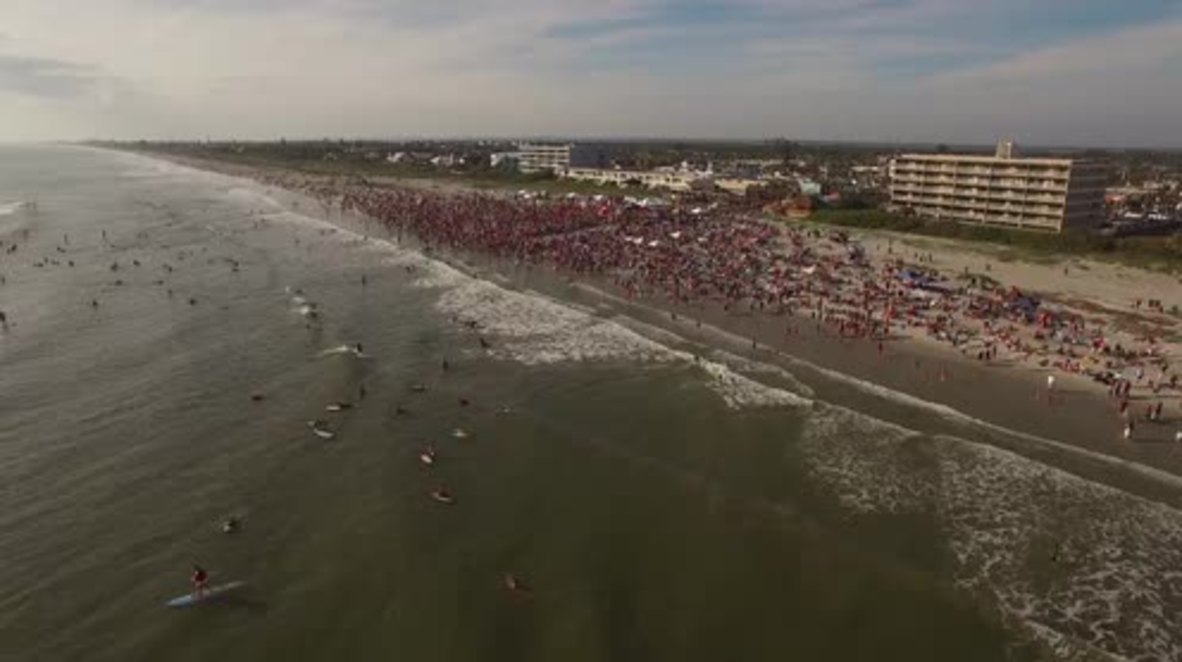 Surfing Santas perform jaw-dropping stunts at Cocoa Beach