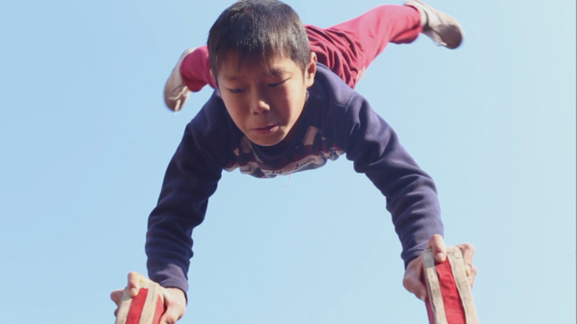 China: Farmers’ kids plough field of acrobatic excellence
