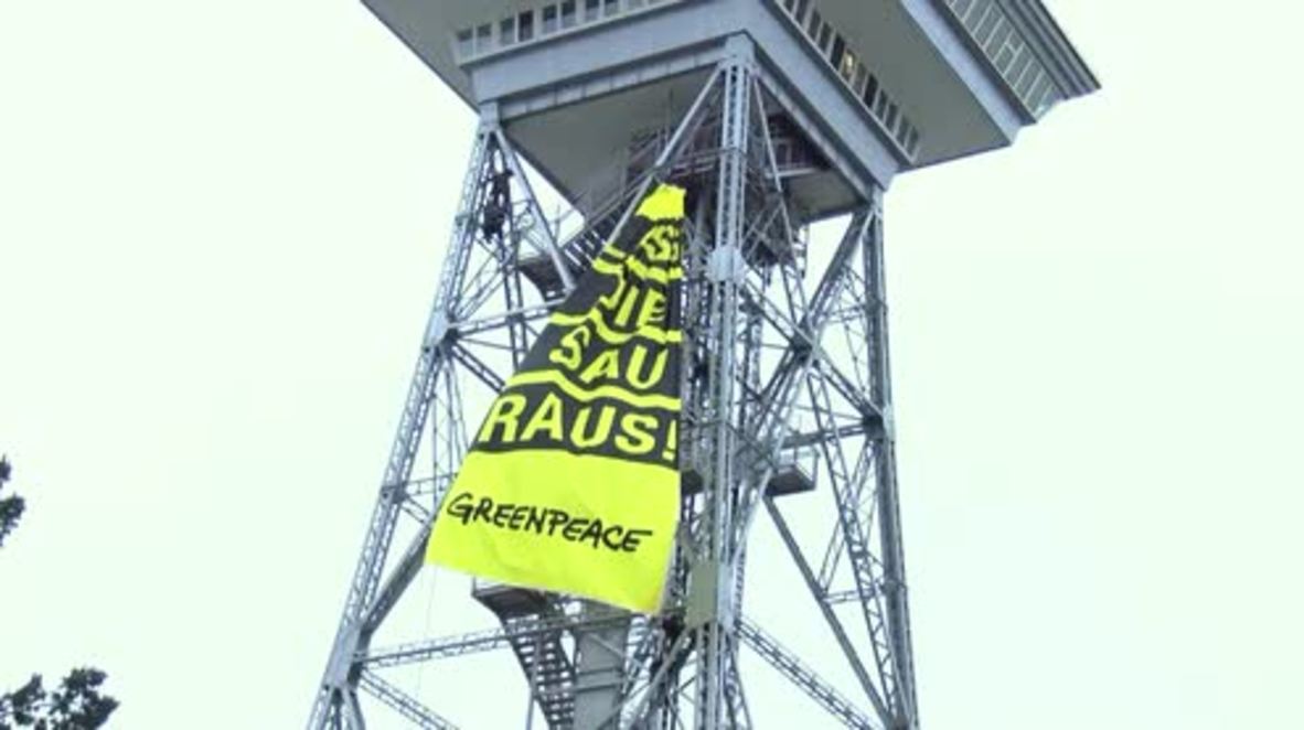 Germany: ‘Let the pigs out’ - Greenpeace activists protest in Messe Berlin