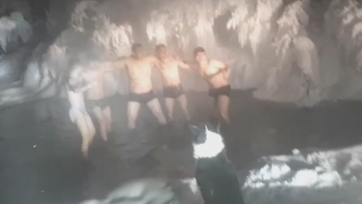 Chinese tourists take freezing -65°C plunge in Oymyakon! *EXCLUSIVE*