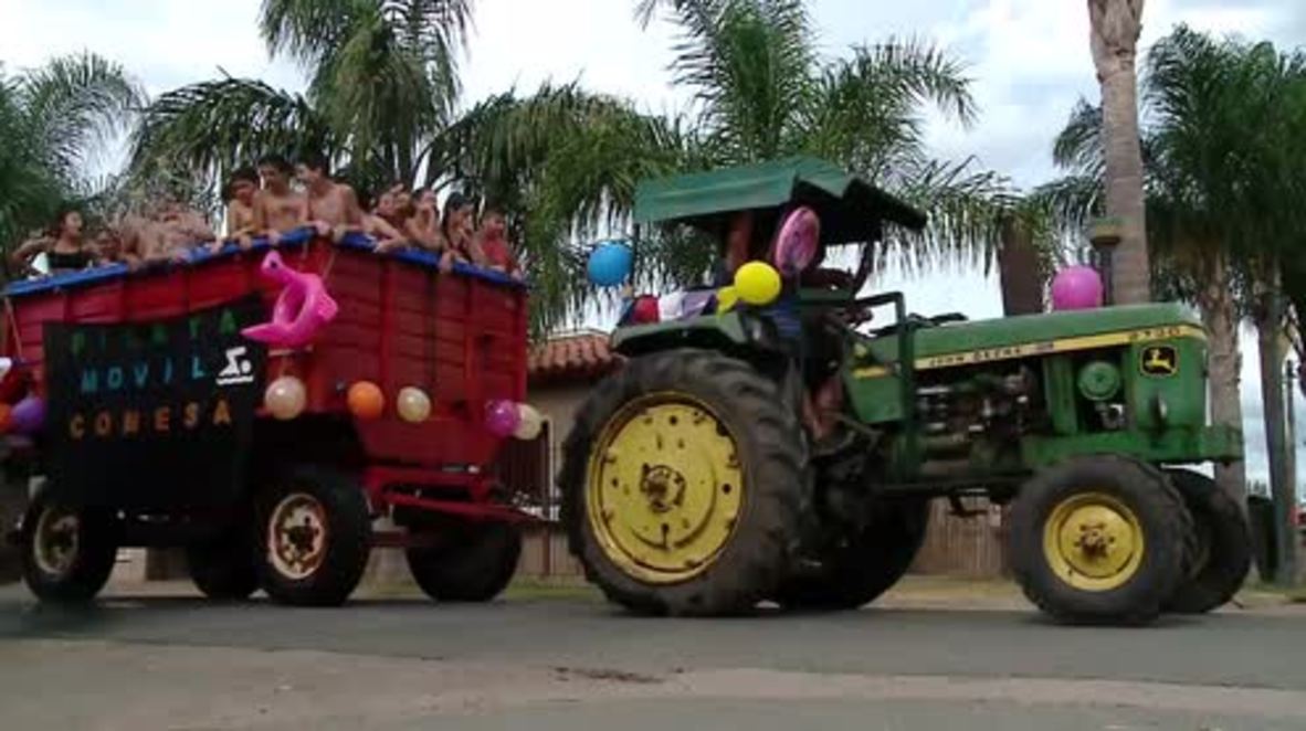 Havin' a splash! Kids in Conesa ride their dream SWIMMING cart