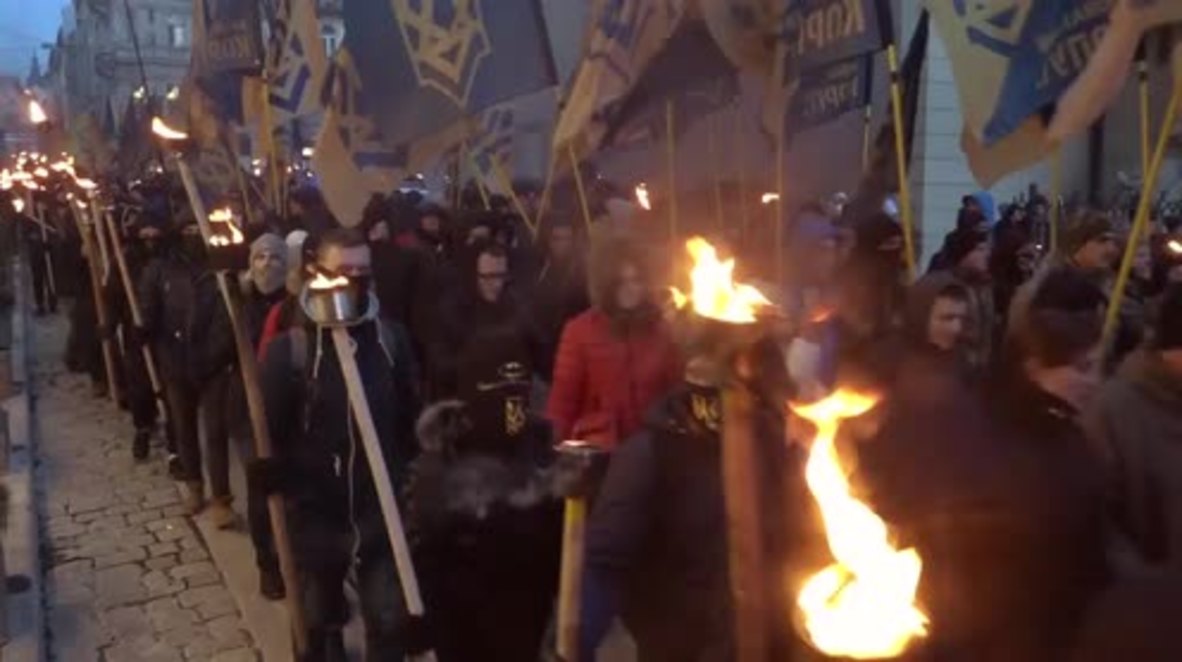 Ukraine: Nationalists hold torch-lit rally in Lviv to honour UPA general
