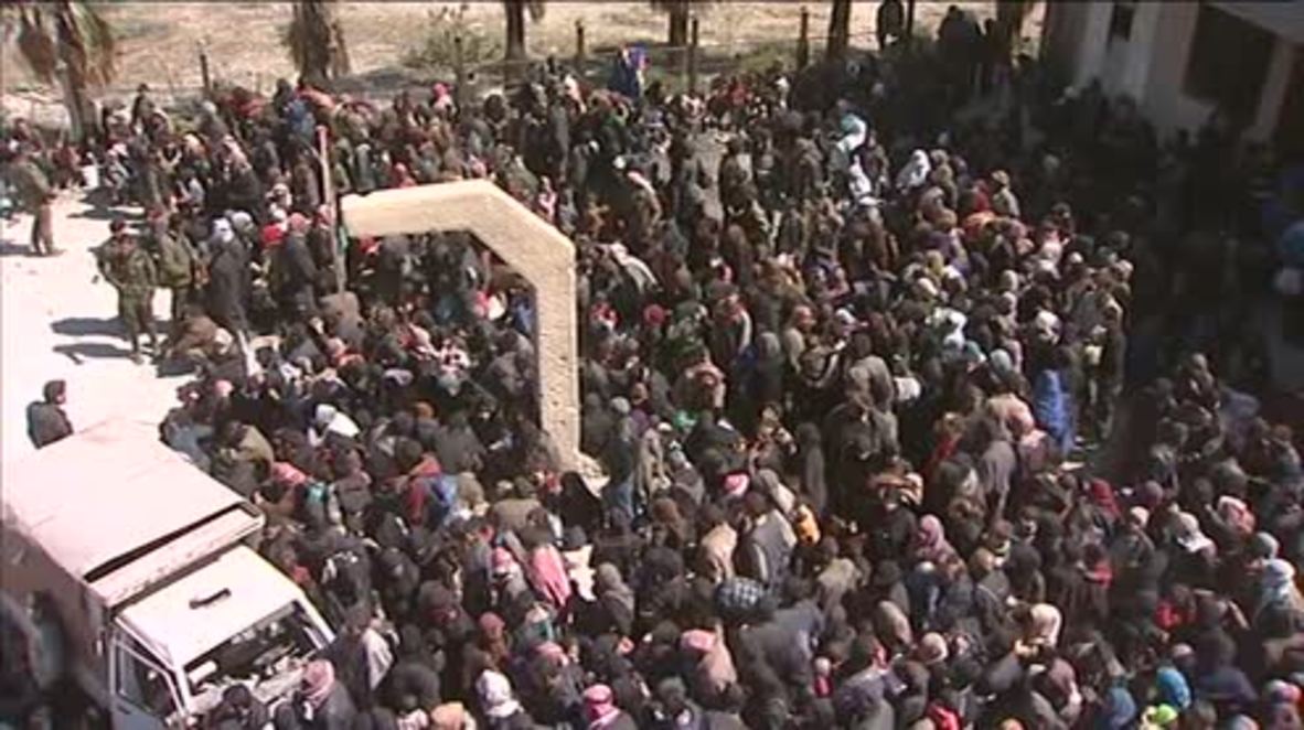 Syria: Hundreds fleeing war-ravaged Eastern Ghouta wait to board buses