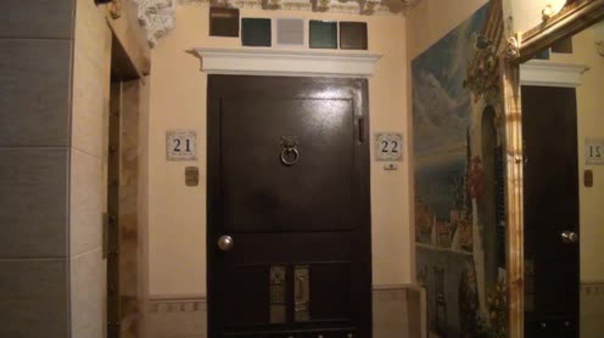 Artist transforms entrance of bland apartment block into baroque-style masterpiece