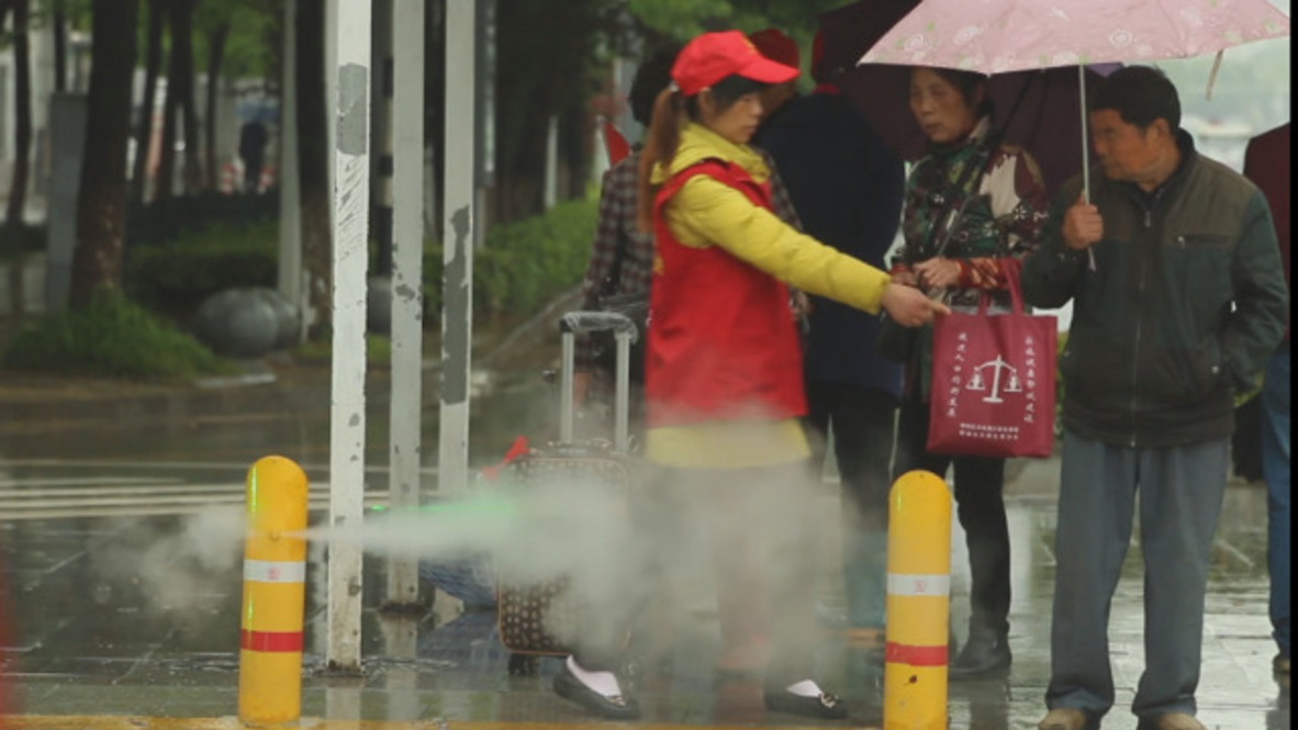 Chinese jaywalkers SPRAYED with cold water for illegal road crossing