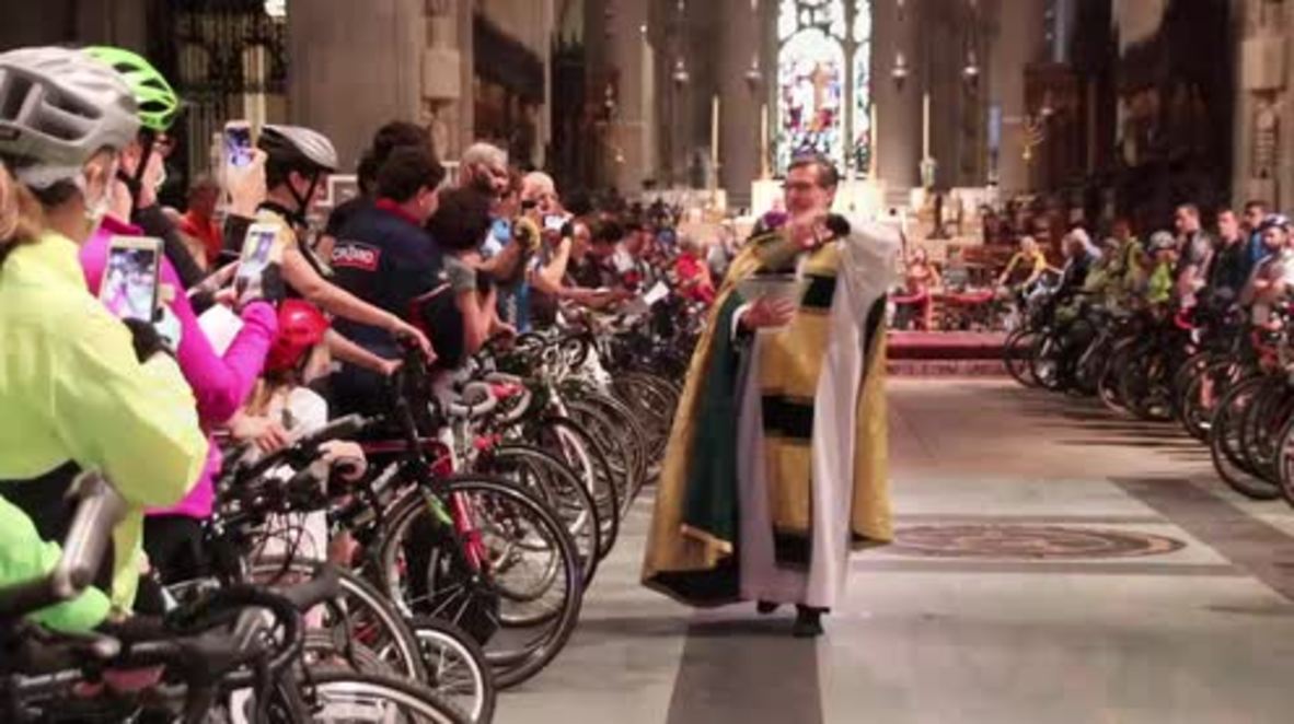 Bless my bike! Rides sprinkled by holy water in NYC Cathedral