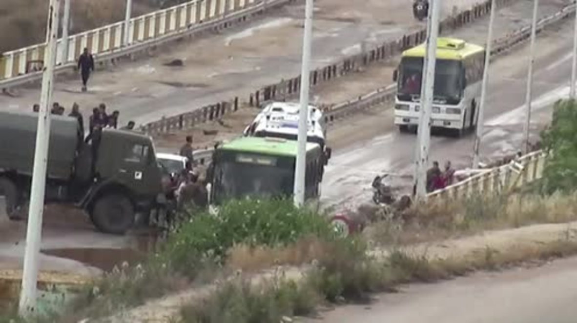 Syria: Militant and families' evacuation via Al Rastan corridor begins