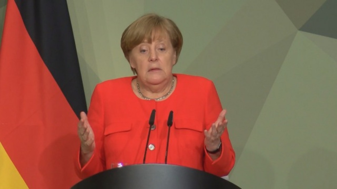 Germany: Merkel urges US to cooperate on Iran and Paris agreements