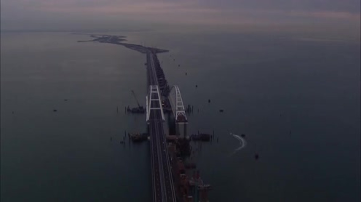 Russia: Honking and flag waving as Crimean Bridge opens to public