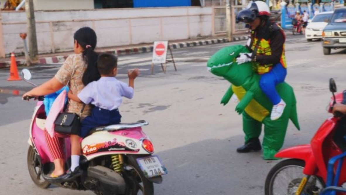 Think-he-sauraus speeding?! T-REX controls roaring Thai traffic