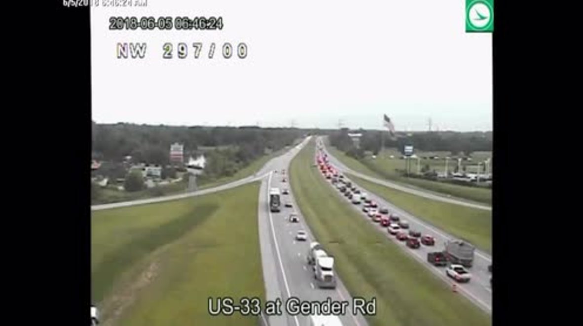 Driver goes into REVERSE along busy US highway to avoid traffic jam