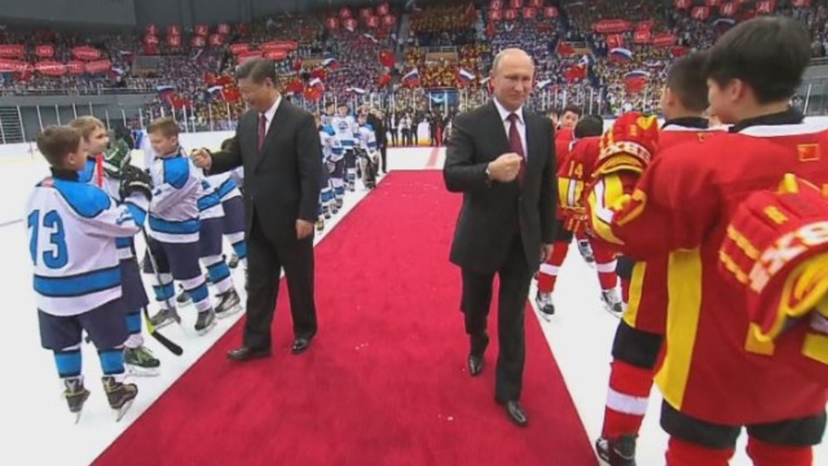 China: Putin and Xi Jinping attend Russia vs. China junior ice hockey match
