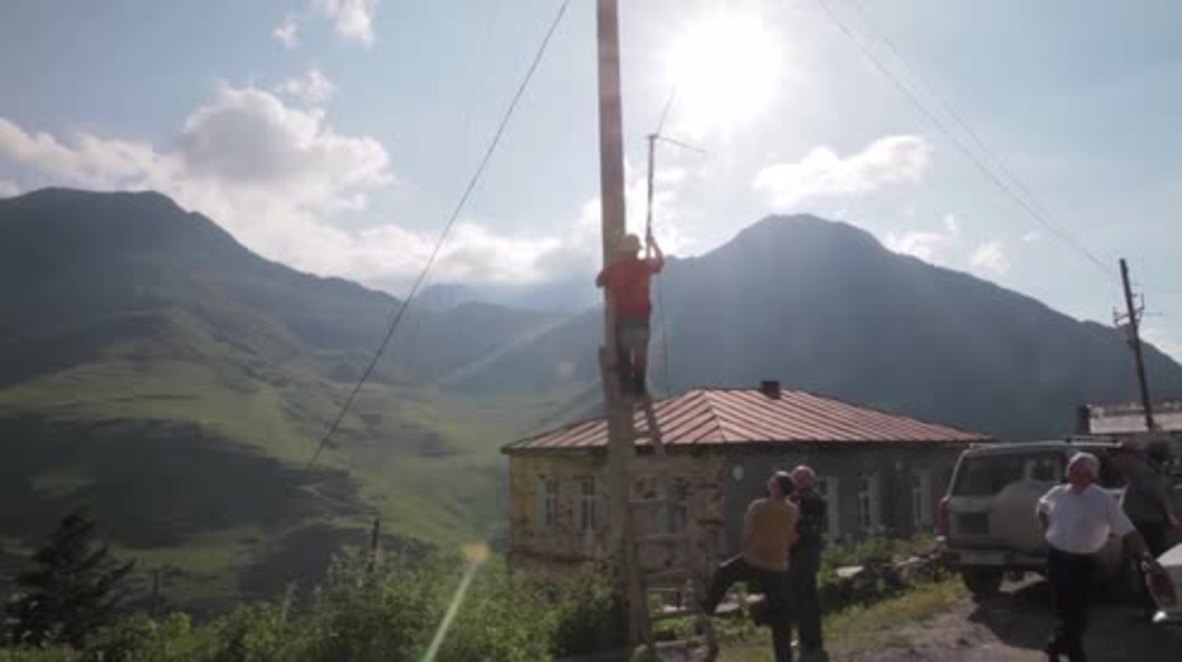 Russia: Mountain settlement residents erect TV-antenna to cheer on Russia