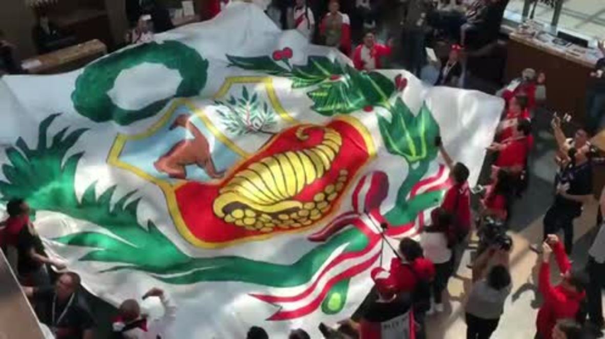 Russia: Peruvian fans wave gigantic flag ahead match against France