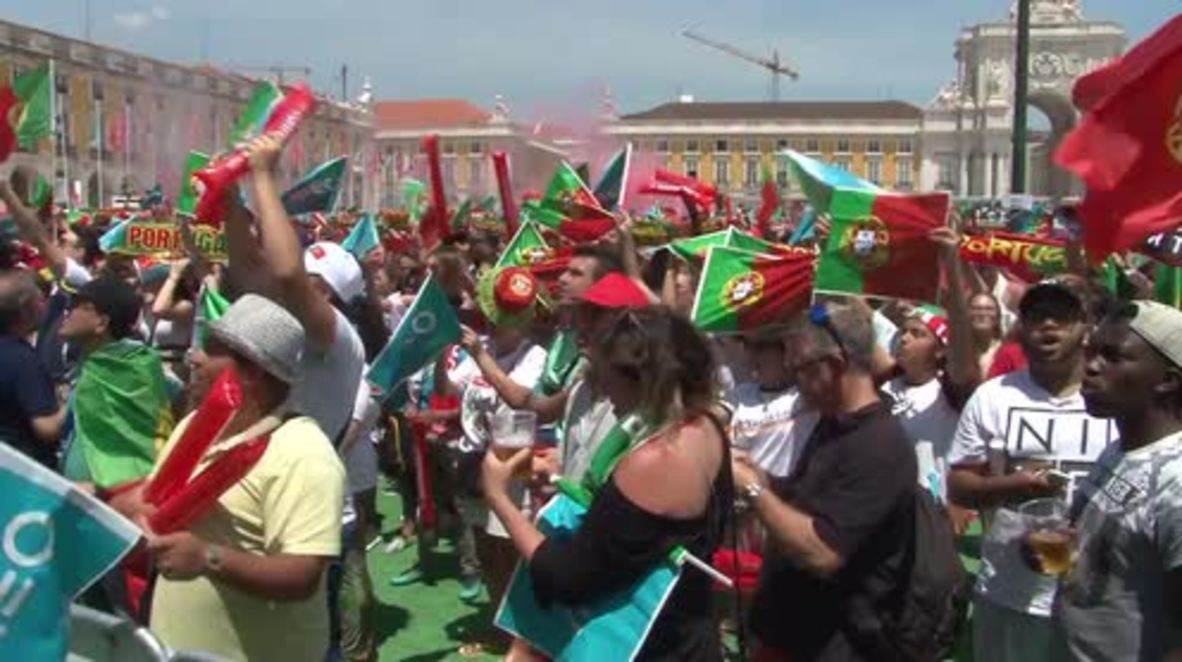 Portugal: Massed fans watch Portugal win at Lisbon public viewing zone