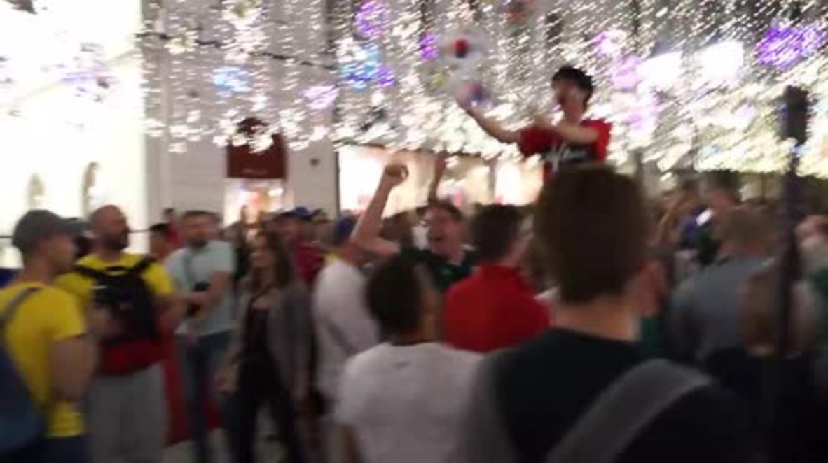 Russia: Mexican fans throw Korean supporter into the air to celebrate Germany defeat