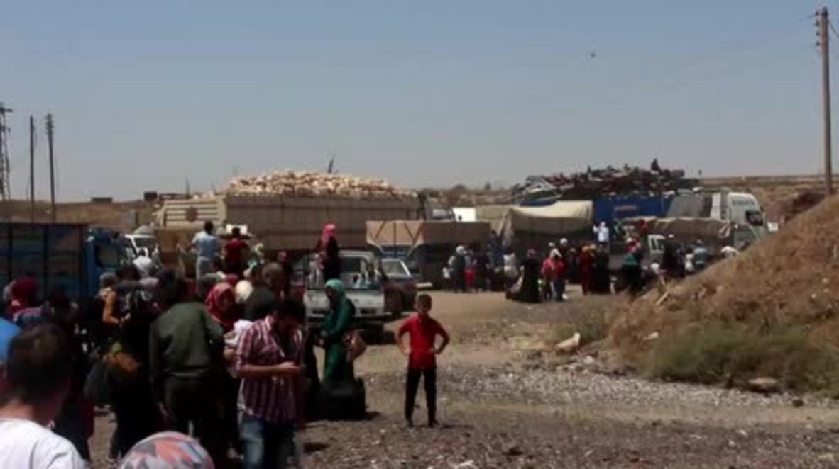 Syria: Dozens of families flee through humanitarian corridor in Daraa