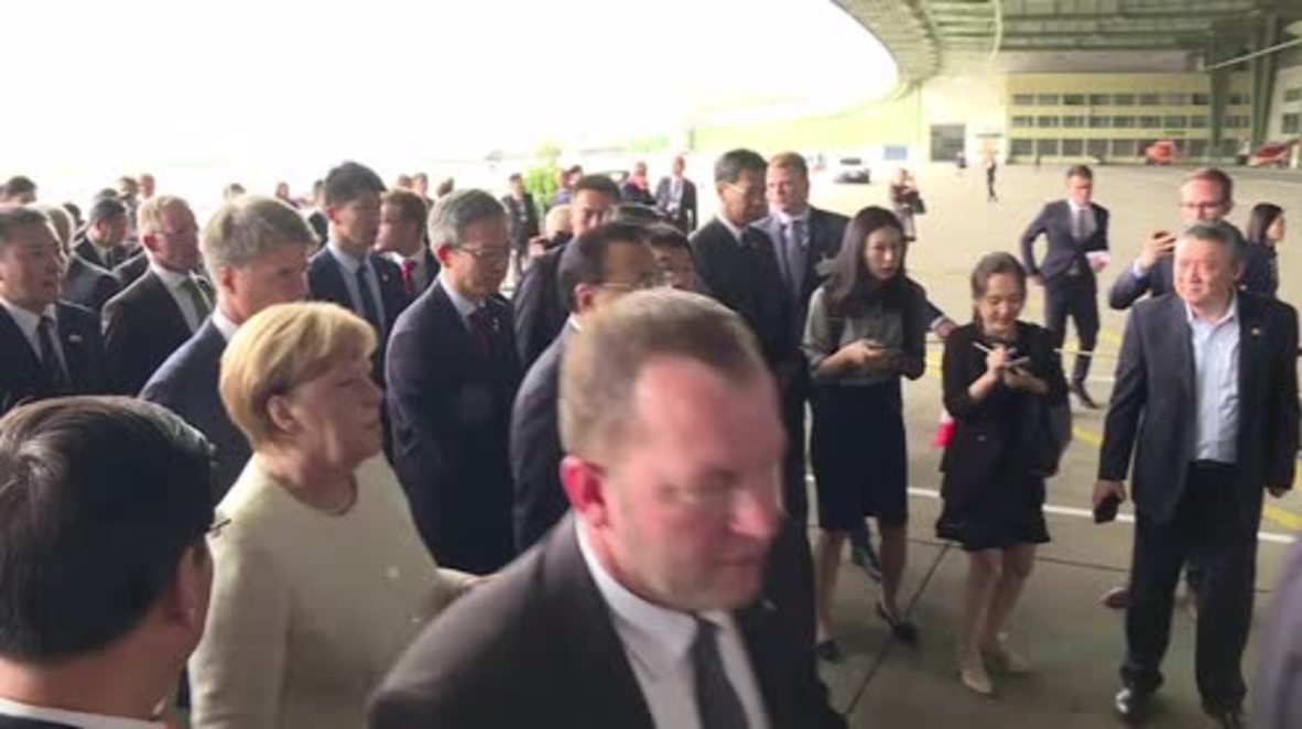 Germany: 'Good day for open transparent cooperation' - Merkel on German-Chinese car industry