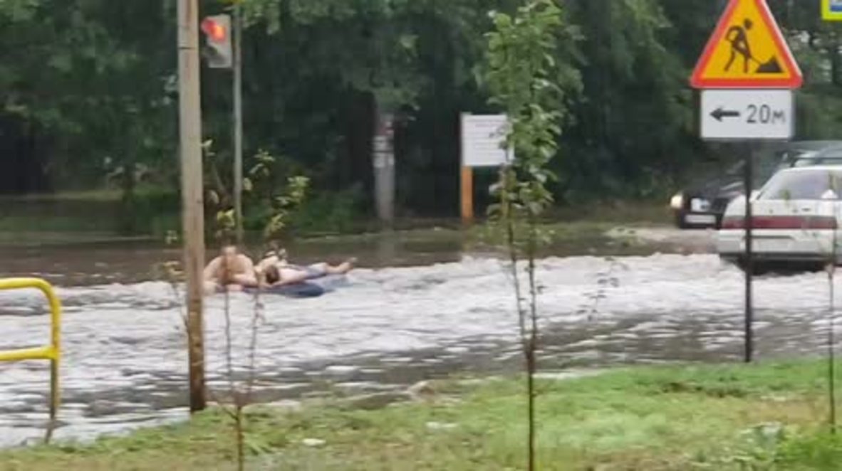 Locals take AIR BED for a ride as flooding hits Tolyatti