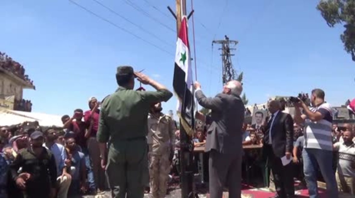 Syria: Syrian flag rises over Nawa after city freed from militant control