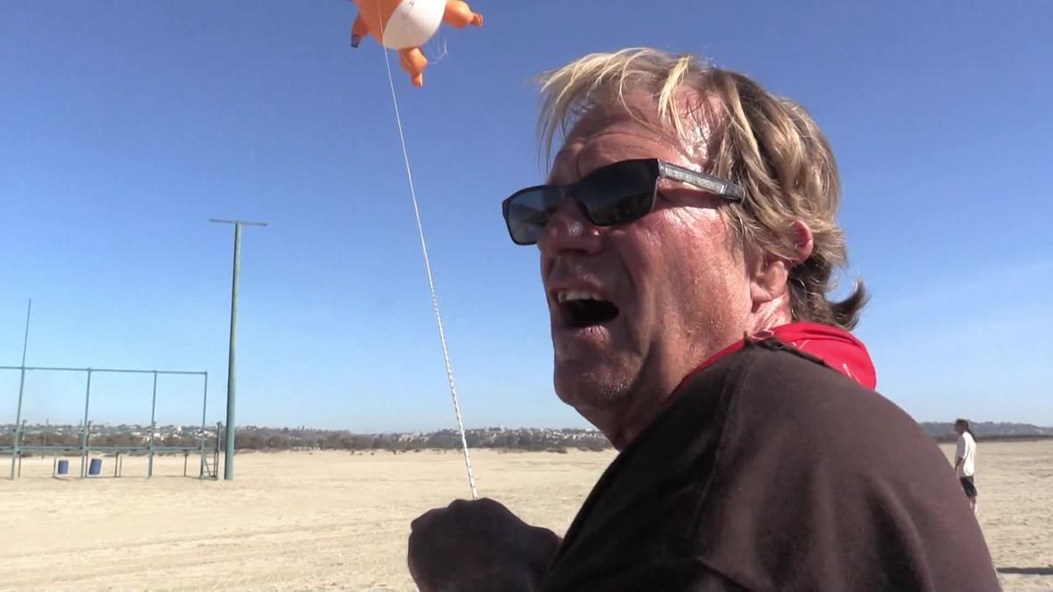 USA: Baby Trump balloon punctures president's immigration talk in San Diego