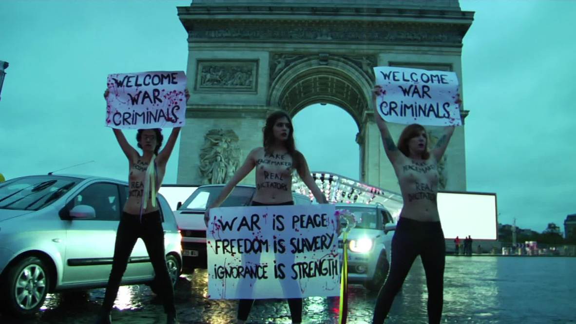 France: Topless FEMEN activists protest in Paris ahead of WWI armistice centenary *EXPLICIT*