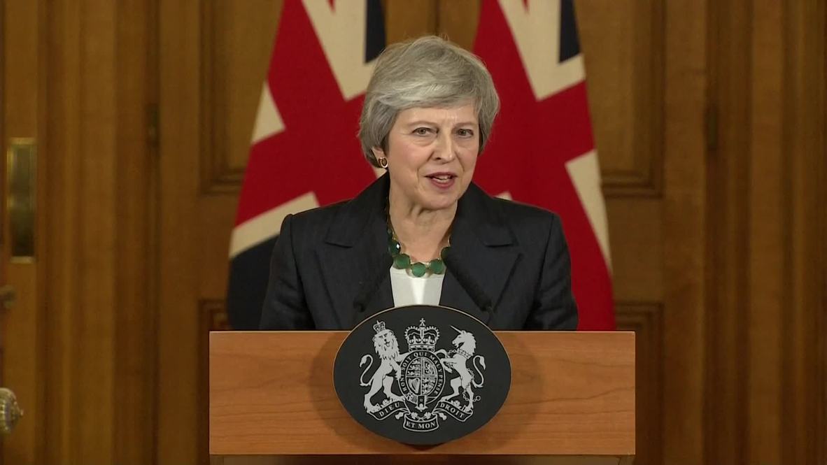 UK: May 'will see through' Brexit deal despite cabinet resignations