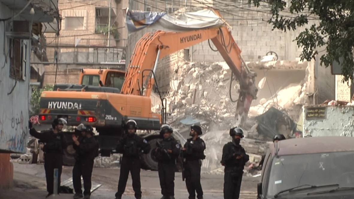 East Jerusalem: Israeli forces demolish Palestinian shops in refugee camp