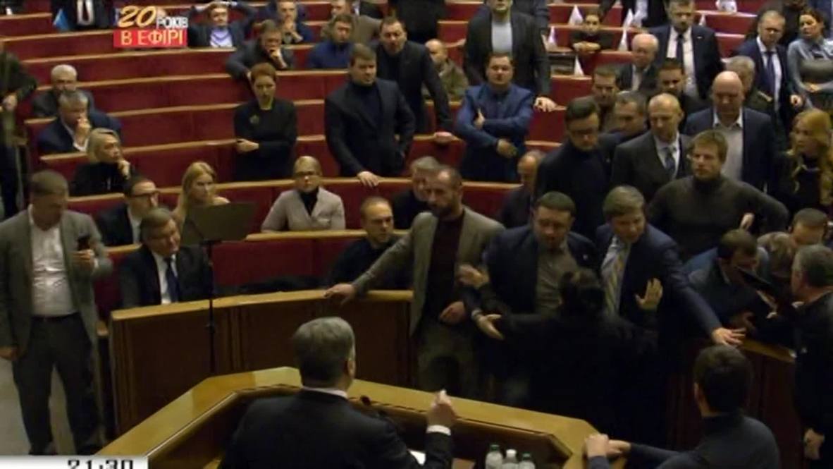 Ukraine: Scuffles break out in parliament as martial law approved