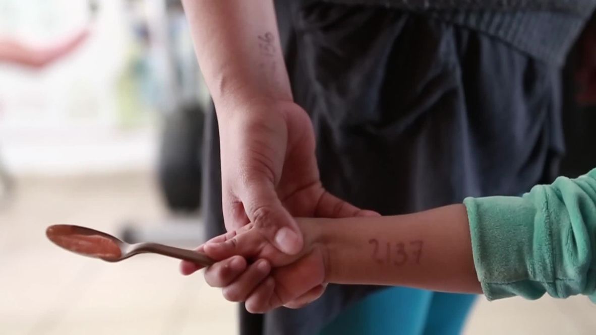 Mexico: Migrant kids marked with numbers as they wait to cross US border