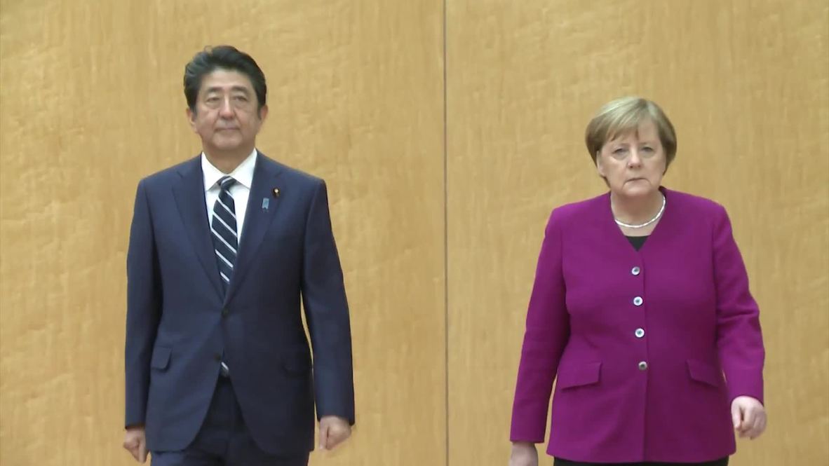 Japan: Abe and Merkel pledge to bolster cooperation at Tokyo talks